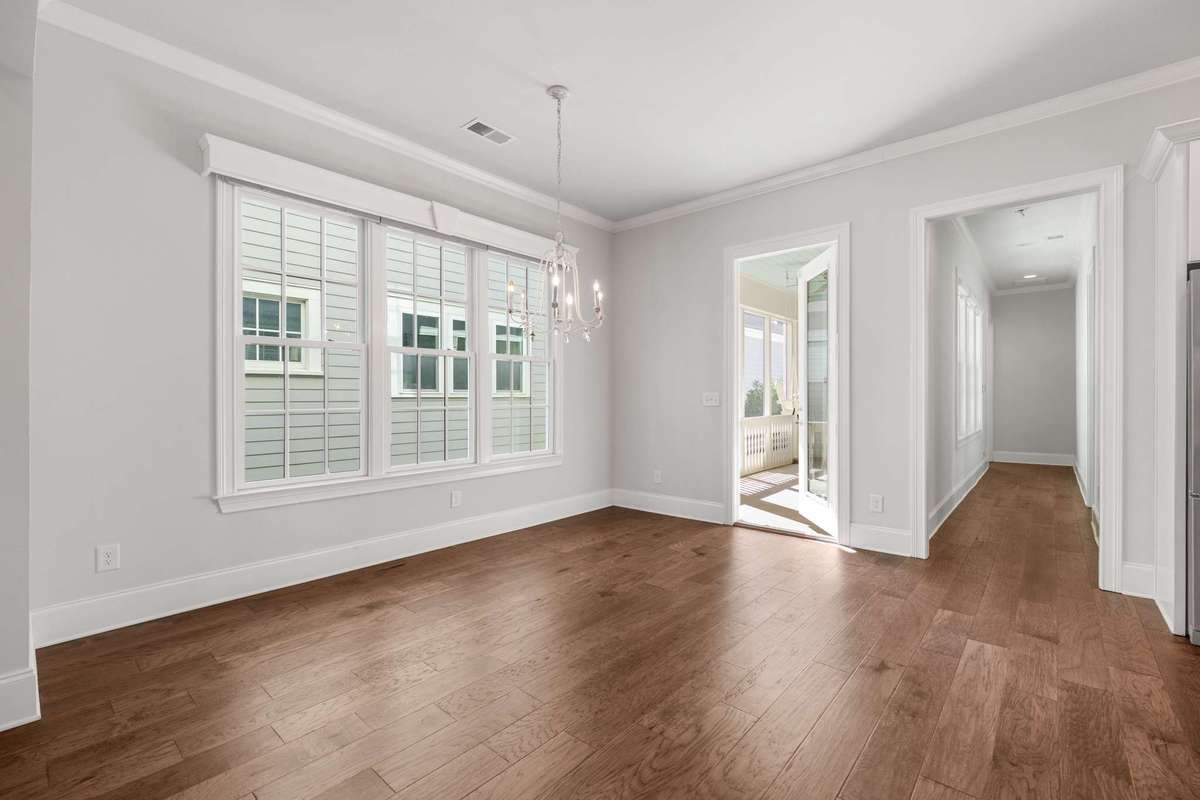 Designated dining space, adjacent to the kitchen and main floor living area provides access to the screened in patio.