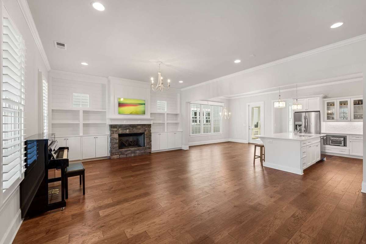 View of the main living area from the front entry.  Gas burning fireplace, and adjacent built-ins trim out the living room nicely.