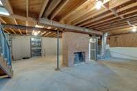 Basement with beautiful wood burning all brick fireplace!