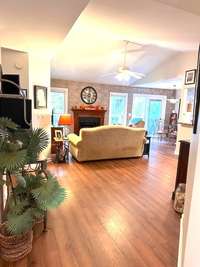 As you enter this lovely meticulously maintained ranch home you will notice the high vaulted ceiling and the cozy fireplace in the family room.