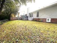 View of the back of the home and backyard.