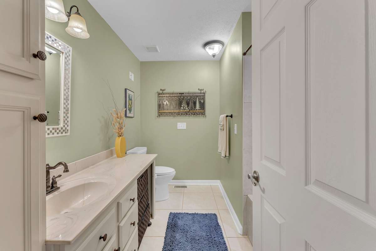 The second full bathroom is across the hall from the second bedroom and just steps away from the open living area on the front of the home.