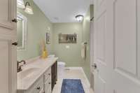 The second full bathroom is across the hall from the second bedroom and just steps away from the open living area on the front of the home.