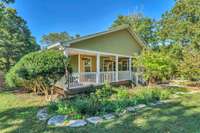 Imagine sitting on the wrap-around rocking chair front porch with your favorite beverage