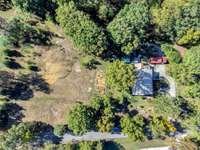This ariel view shows you the home on the right and the additional 1.57 acre lot.