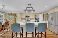 The pot rack above the island will remain.