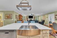 The open floor plan allows for easy interaction during meal preparation.