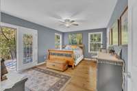 The primary bedroom is tucked away in the back corner of the home.