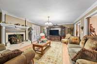 another view of the den. French doors lead to the sunroom.