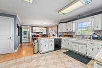 Kitchen with an abundance of cabinetry and pantry.