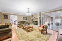 Large den with gas log fireplace is perfect for family gatherings.