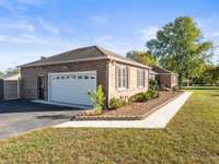 Two car garage, a brand new $26,000 architectural shingle roof, large lot and more.