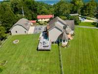 Aeriel View of Property w/ Firepit in the Backyard