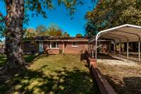 Nice-sized carport for protecting your vehicle.