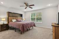 large primary suite with new carpet