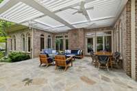 The sunroom and kitchen breakfast nook both open to this space, allowing for seamless transition from inside to outdoors and an ease of flow for entertaining!
