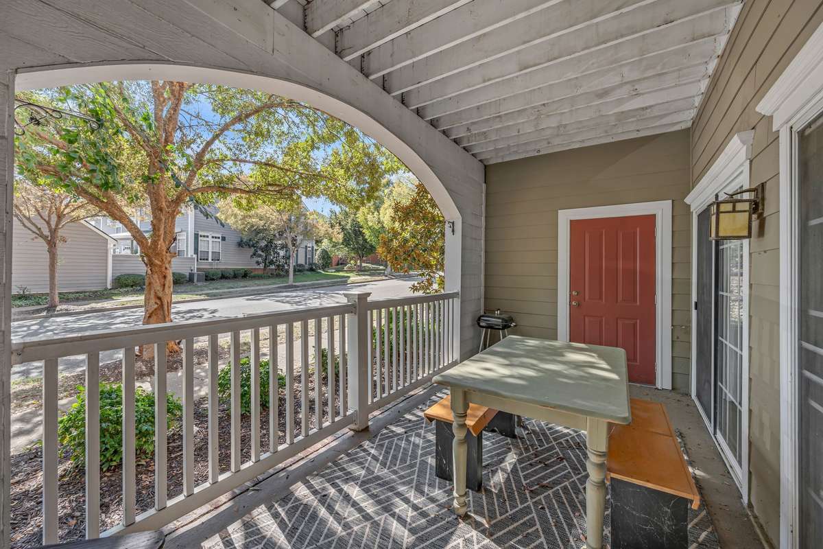 You'll love the spacious patio space for entertaining guest & morning coffee. The Red door is storage and also holds the water heater.