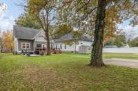 Flat backyard with beautiful mature trees