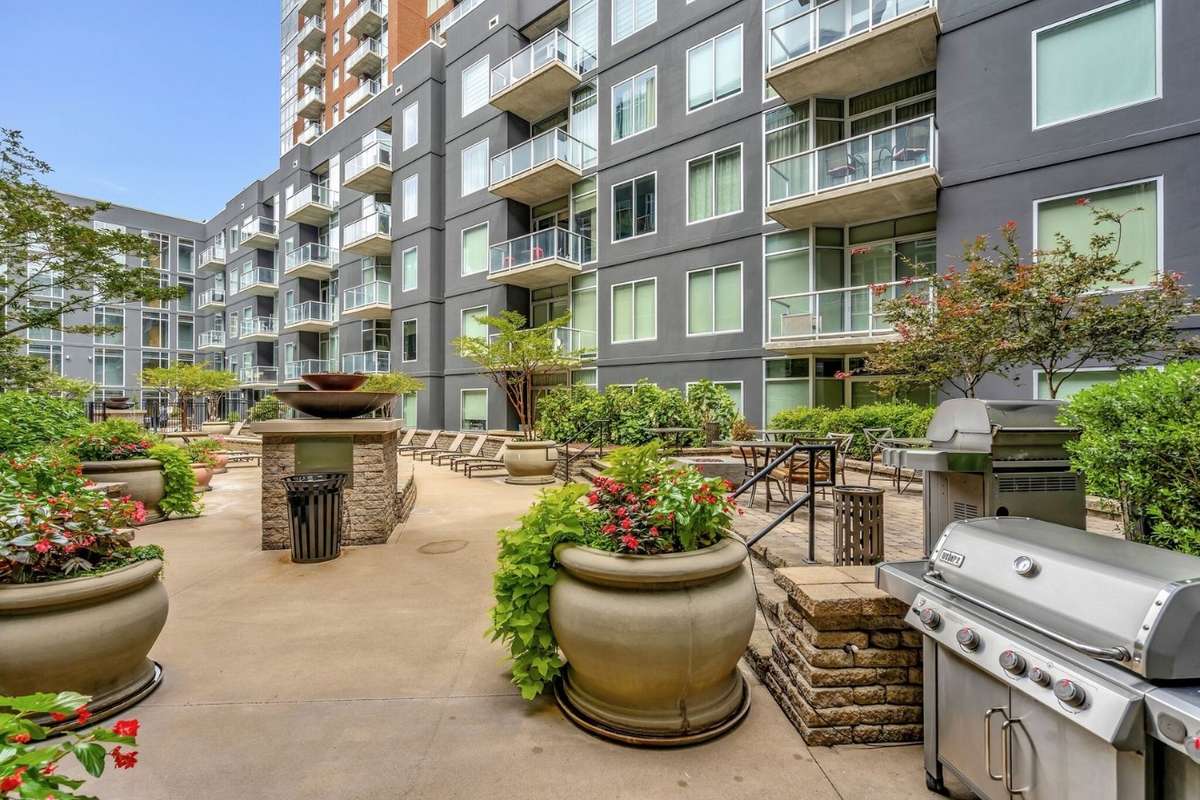 Close grill and sitting area right across the hallway to relax and enjoy after a long workday.