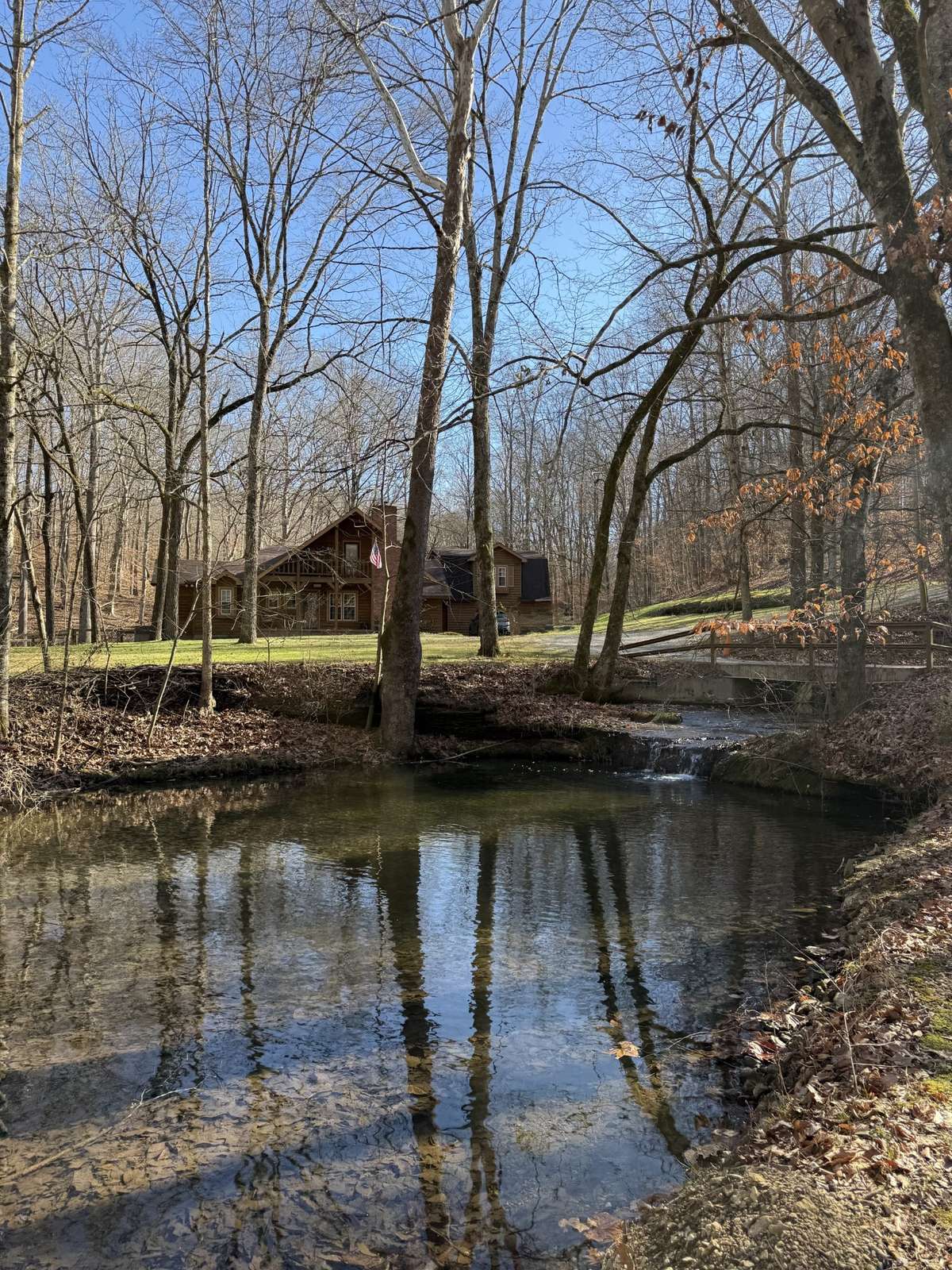 Spring Water, Creeks, Waterfalls surrounding the property - there are 4 creeks and 3 springs on the property - 1 spring has a 600 gallon reservoir and is hooked up to the home. You can switch between city water or spring water. 1 is a sulfur spring.