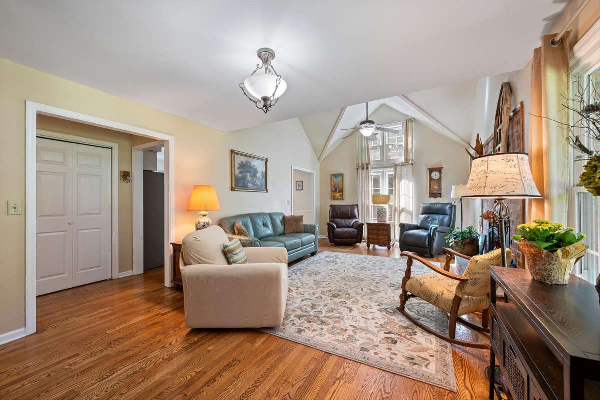 Living Room w wood fireplace insert, partial vaulted ceiling (loft overlooks the living room)