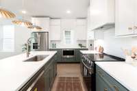 Spacious kitchen with plenty of cabinet space and generous pantry.