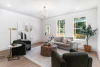 Spacious Living Room overlooking back yard.