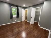 Bedroom 1: This primary bedroom is complete with a large closet and half bath.