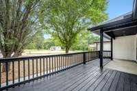 Great deck for sitting and enjoy ing the outdoors