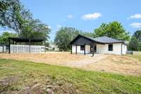 View of the back of house and carport.