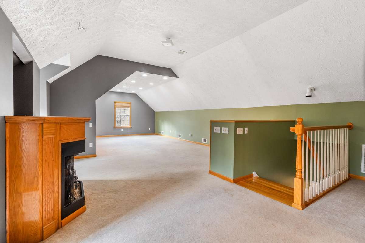 Upstairs bonus room, with gas fireplace