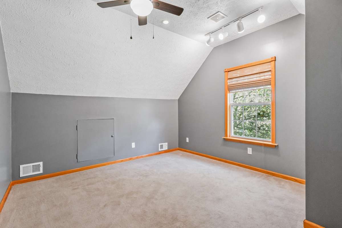upstairs office area with closet