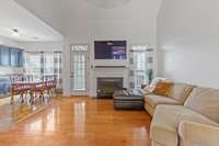 The home features a split floor plan with bedrooms on each side and the living space, kitchen, and dining in the middle.