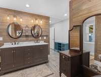 Double vanity and wood accent walls