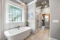 Primary suite soaking tub with tile surround