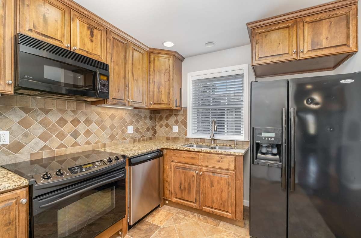 Take a closer look at these cabinets! The Sink overlooks the back patio and offers two separate deep sinks.