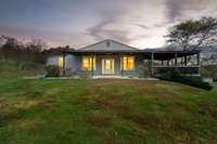 Enjoy outdoor time on the wrap around porch.