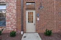 Exterior Door from the gated parking lot