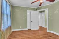 Bedroom with closet and hardwoods
