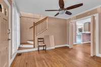 Living room on main floor, notice all the beautiful hardwoods all through the home. This could be used as a large entry room or Music room.