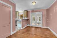 Dining room with French doors to the Den or Sunroom.
