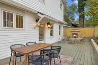 Outside the spacious deck is flanked by a gas burning outdoor fireplace.