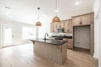 Reeded, white oak island and designer finishes make this a showplace!