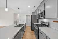 You are correct: that is additional pantry space AND a gas stove!