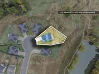 With one of the largest lots in the neighborhood and next to a...wait...is that a....