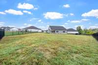 Large extended patio and completely fenced in.