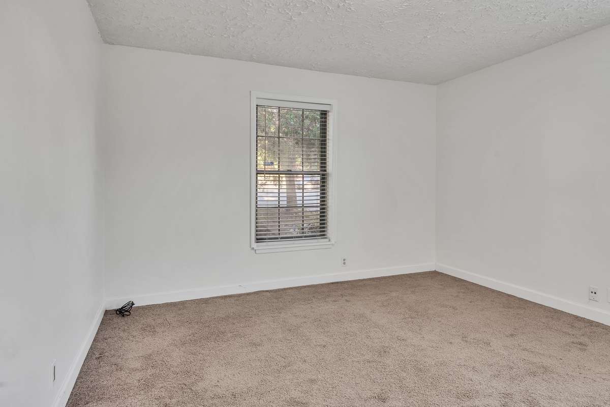 The bedroom has carpet