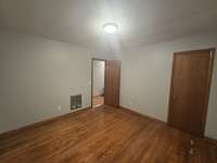 Bedroom 1-original Hardwood flooring, new paint, new light fixture.