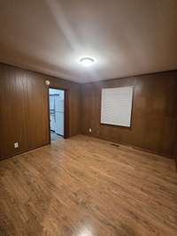 Bedroom 3-origianl hardwood floors-has a pull door leading to kitchen