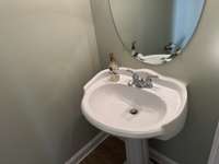 Half bath in hallway downstairs